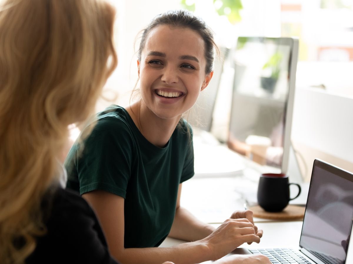 A peer navigator and a participant working together at a laptop