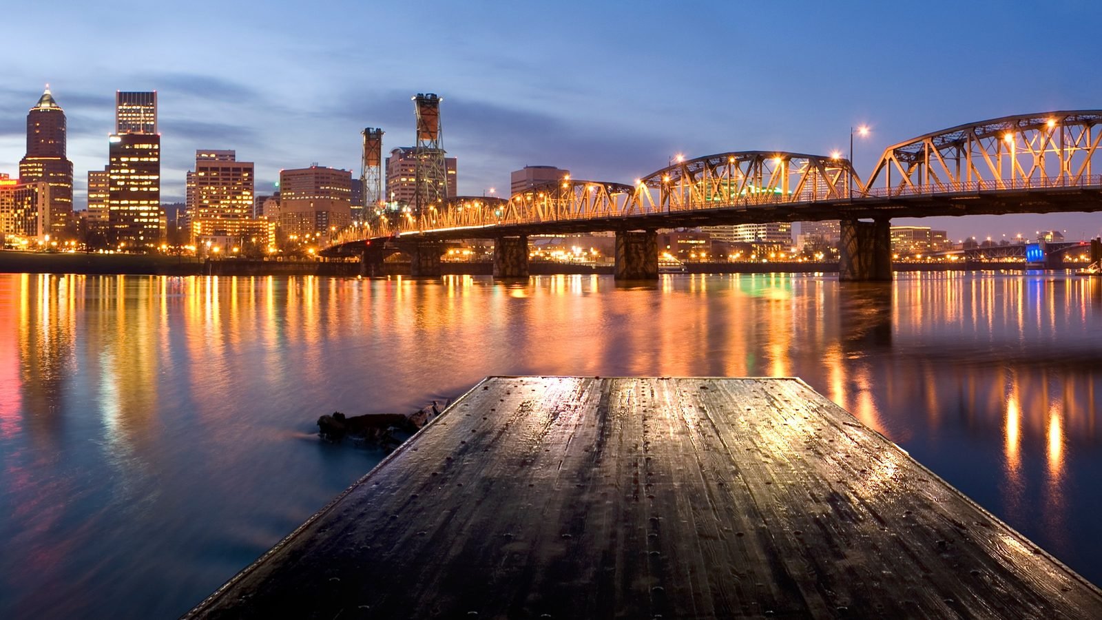 Portland skyline and the Hawthorne Bridge over the Willamette River at dusk