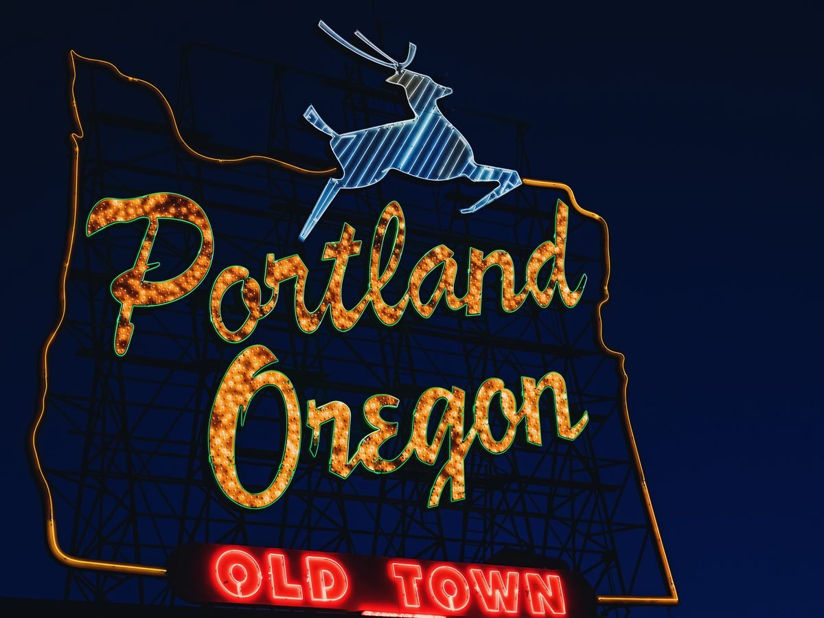 The Portland Oregon sign in Old Town at night